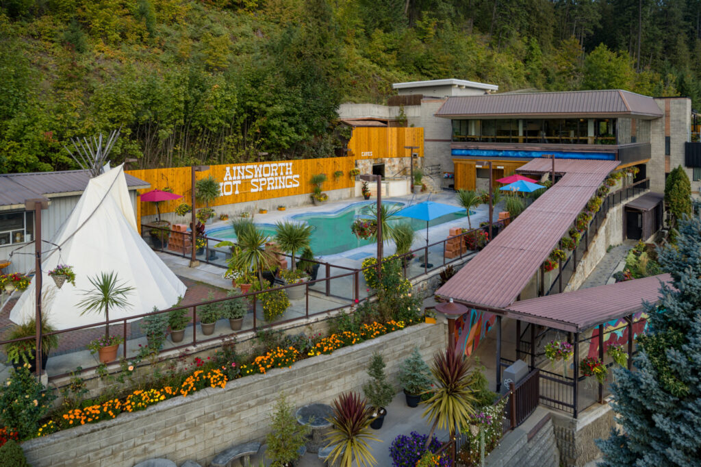 Aerial view of the pools and cave entrance at Ainsworth Hot Springs Resort